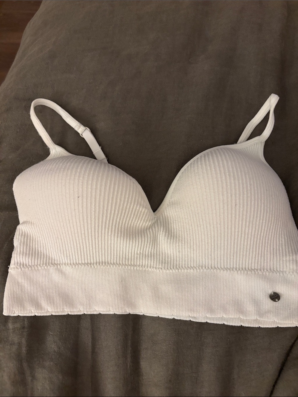 White Ribbed Seamless Bralette with adjustable straps and padded cup size med